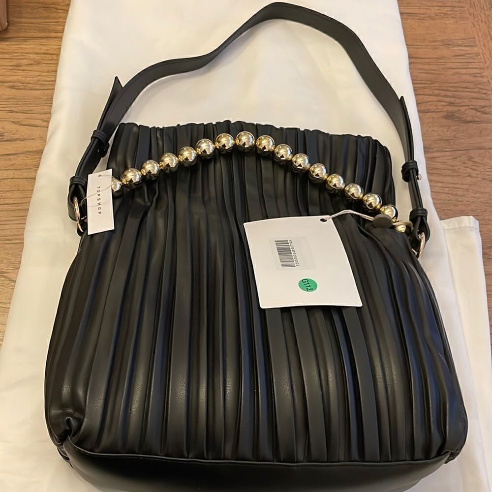 TOPSHOP ELEGANT VEGAN HANDBAG WITH BOLD GOLD DETAIL THAT SWINGS ACROSS B…